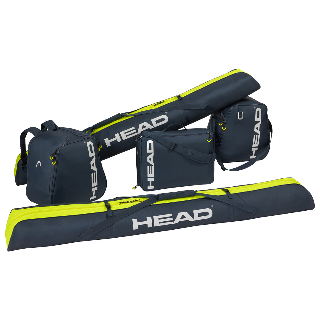 Blau-gelbe HEAD Skibag 175cm, Skischuhtasche, Rucksack und Umhängetasche liegen gestapelt auf einem weißen Hintergrund.