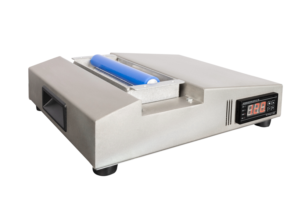 Silbernes Waxpro 160 Gerät Silbernes Wintersteiger Waxpro 160 digital Gerät mit blauer Walze und digitaler Temperaturanzeige.