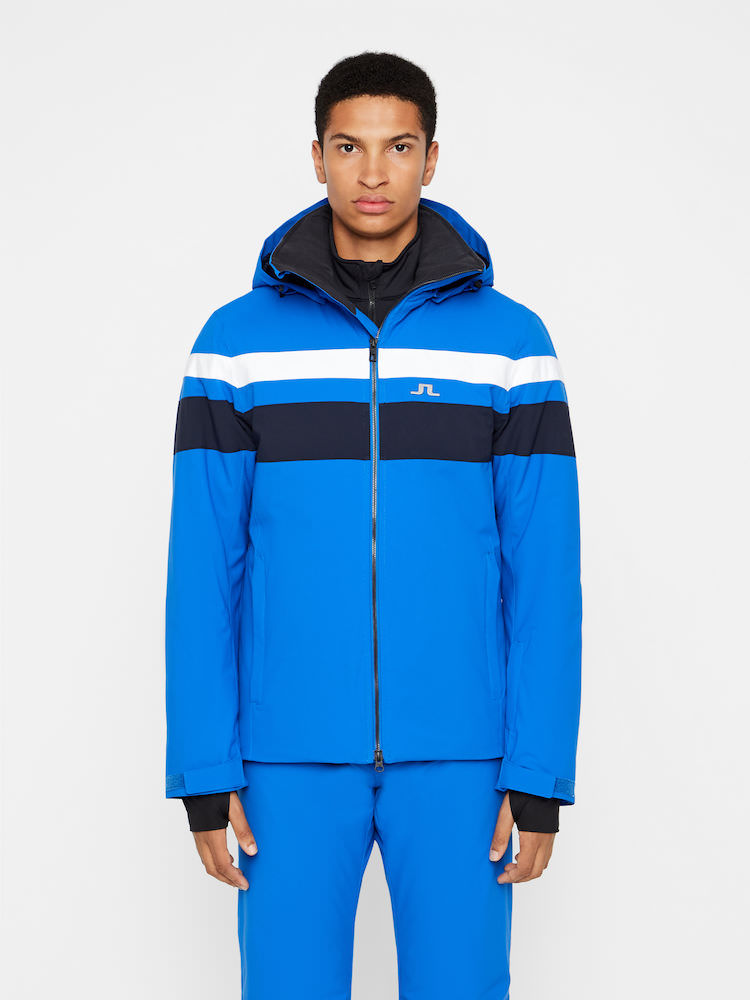 J.Lindeberg Franklin Skijacke Blaues J.Lindeberg Franklin Skijacke mit weißen und dunklen Streifen, von vorne an einem Model getragen.