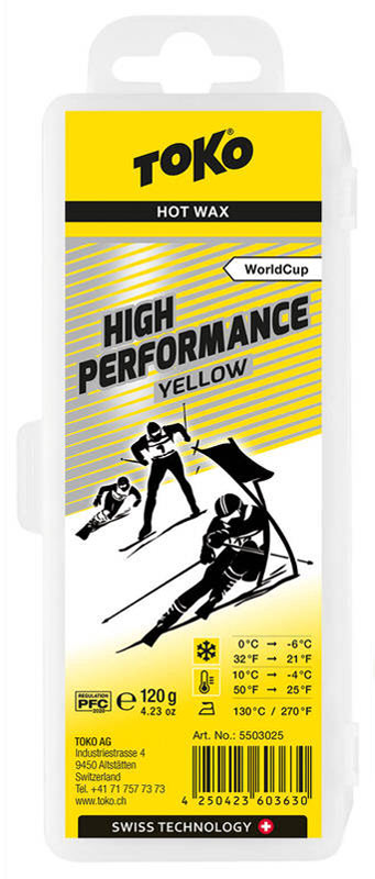 Verpackung Toko High Performance Yellow Skiwachs mit Skifahrern-Illustration und Temperaturangaben.