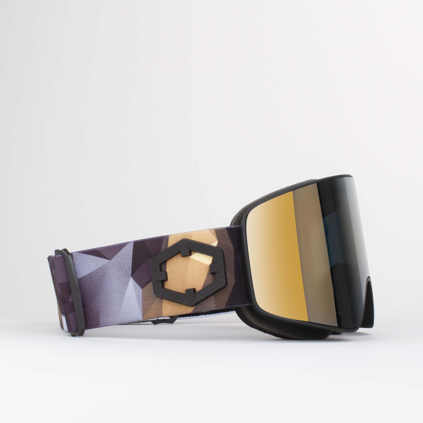 Lunettes de ski Origami Gold24 Lunettes de ski Out Of Void Origami Gold24 avec bandeau à motifs et lentille cylindrique dorée, vue latérale.