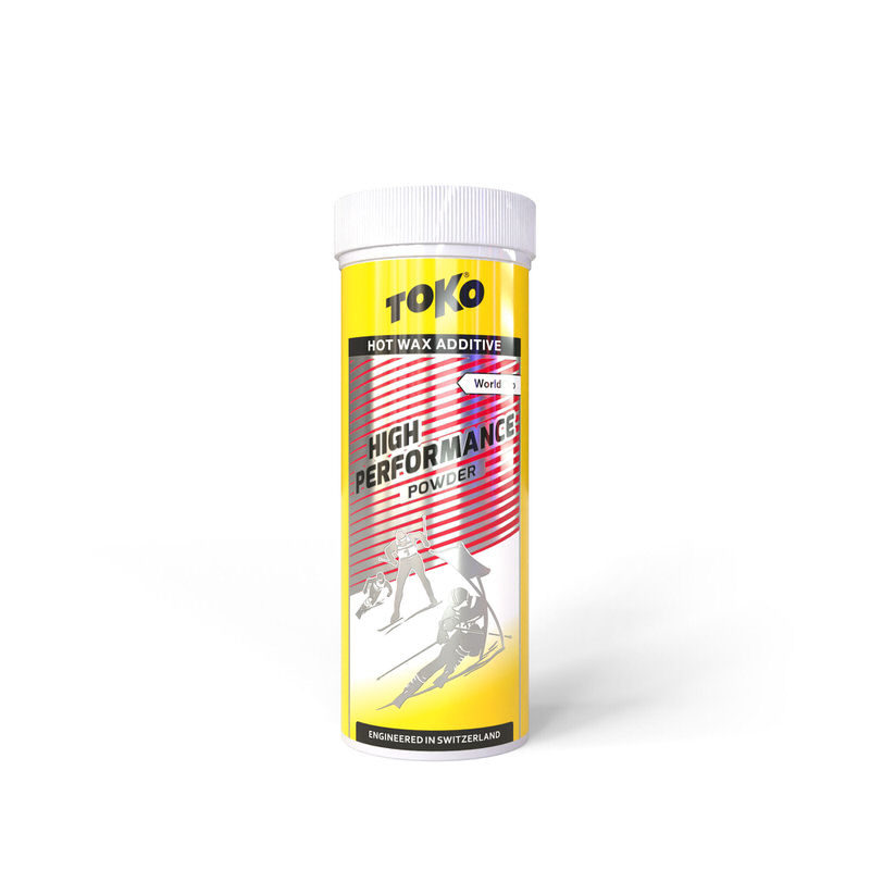 Gelbe Dose mit Toko High Performance Powder Red für Ski, mit Skiläufer-Motiv.