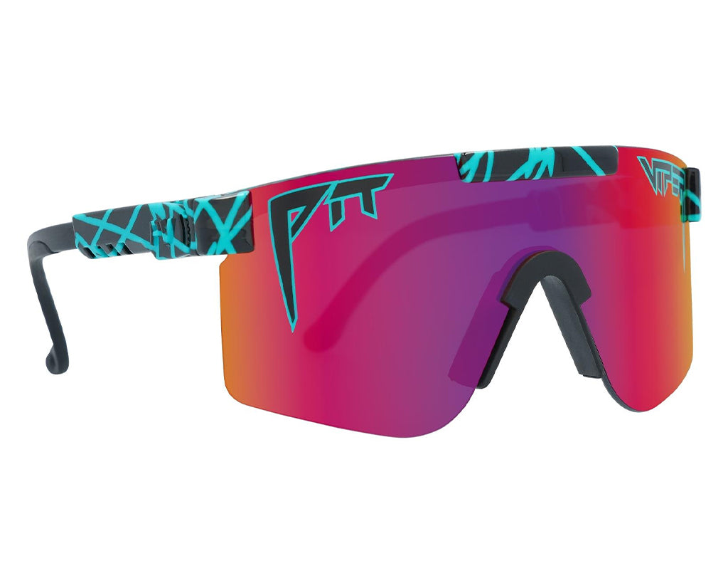 Lunettes de soleil polarisées roses et violettes de la marque PitViper "The Voltage" avec monture noire et accents turquoises.