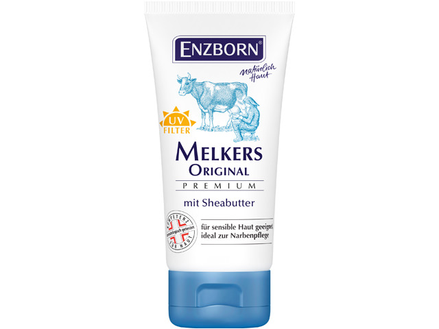 Weiße Tube Enzborn Melkers Original Premium Sheabutter mit Kuh- und Melker-Illustration. UV-Filter und Text.
