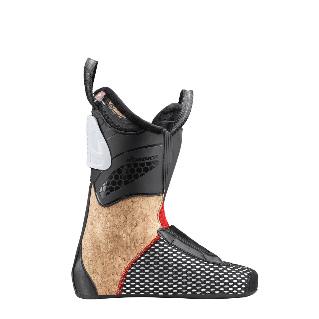 Nordica Pro Machine Innenschuh Innenschuh des Nordica Pro Machine 115 Women Skischuhs, Profilansicht. Schwarzer Schaft, Kork-Mittelteil und weiß gepunkteter Fußbereich.