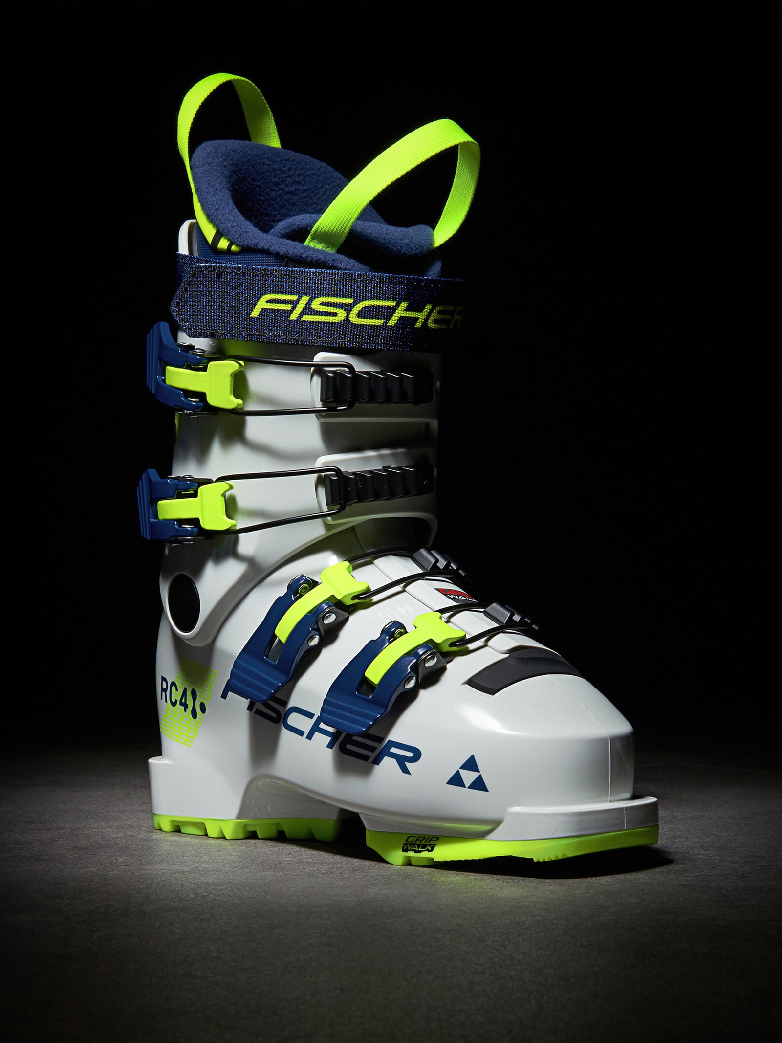 Weißer Fischer RC4 60 JR Skischuh mit blauen und neongelben Akzenten, seitliche Ansicht.