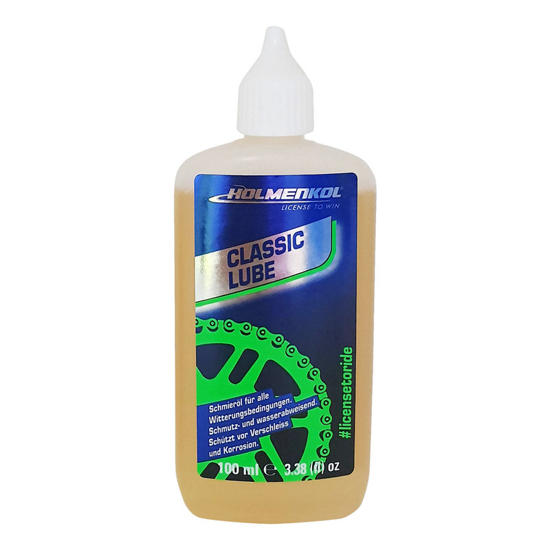 Flasche Holmenkol Classic Lube Kettenöl, hellbraune Flüssigkeit, blau-grünes Etikett mit Ketten-Grafik.