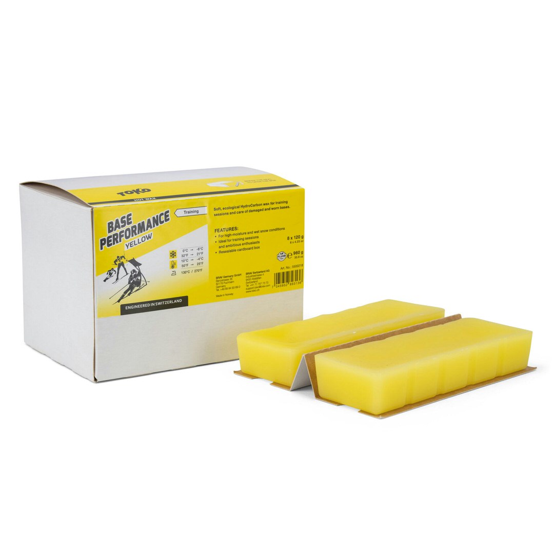 Verpackung Toko Base Performance Yellow Heisswachs mit zwei gelben Wachsblöcken.